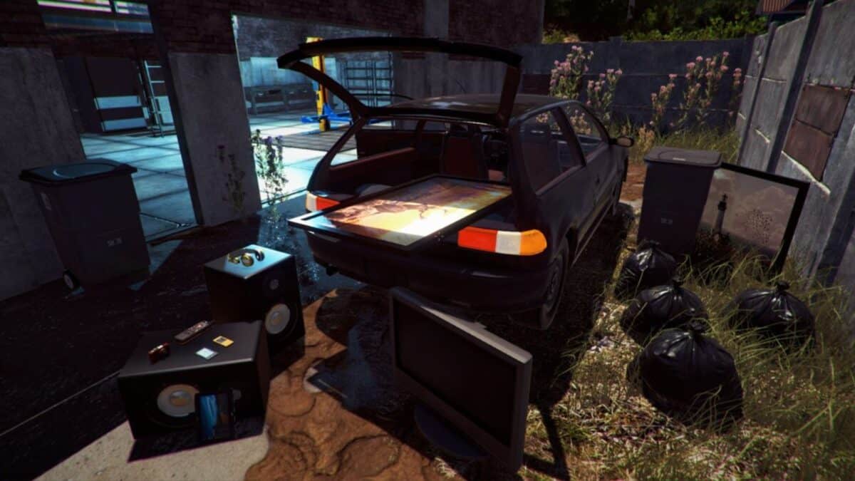 A hatchback car with an open trunk is surrounded by electronics, garbage bags, and speakers in an overgrown, urban alleyway.