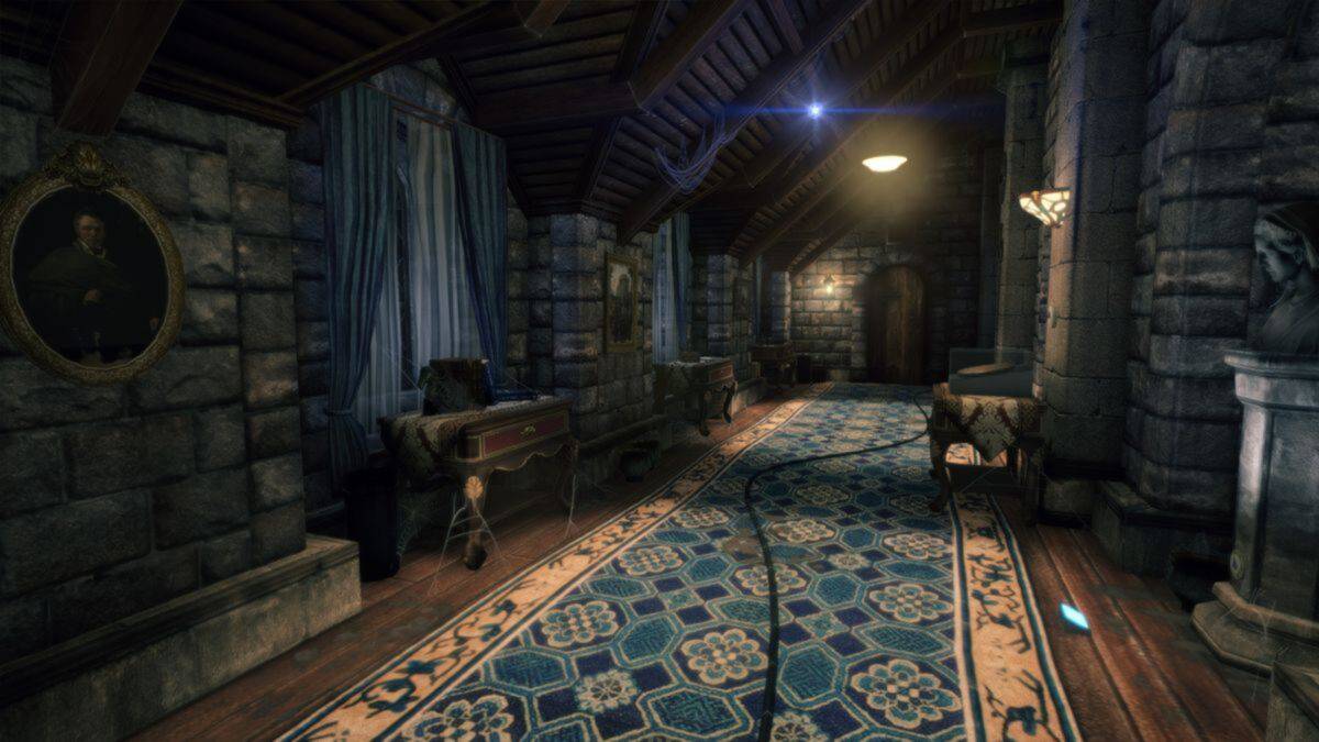 A dimly lit stone hallway with a patterned blue carpet, antique furniture, portraits on the walls, heavy curtains, and a bust on a pedestal.