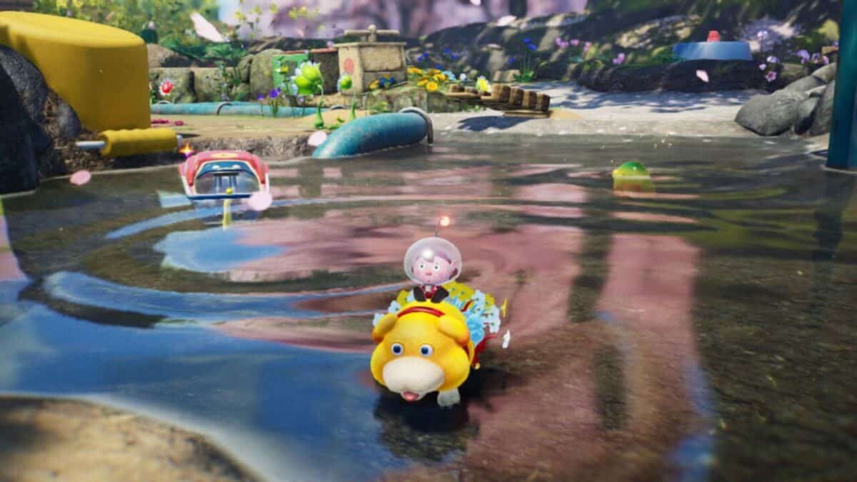 A cartoon character in a space helmet rides a yellow animal-like creature across a shallow, colorful pond in a whimsical, animated outdoor setting.