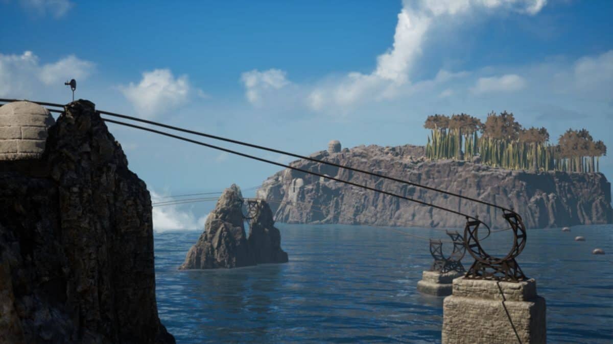 A cable system stretches across rocky cliffs over water, with a small island featuring tall, sparse trees in the background under a partly cloudy sky.