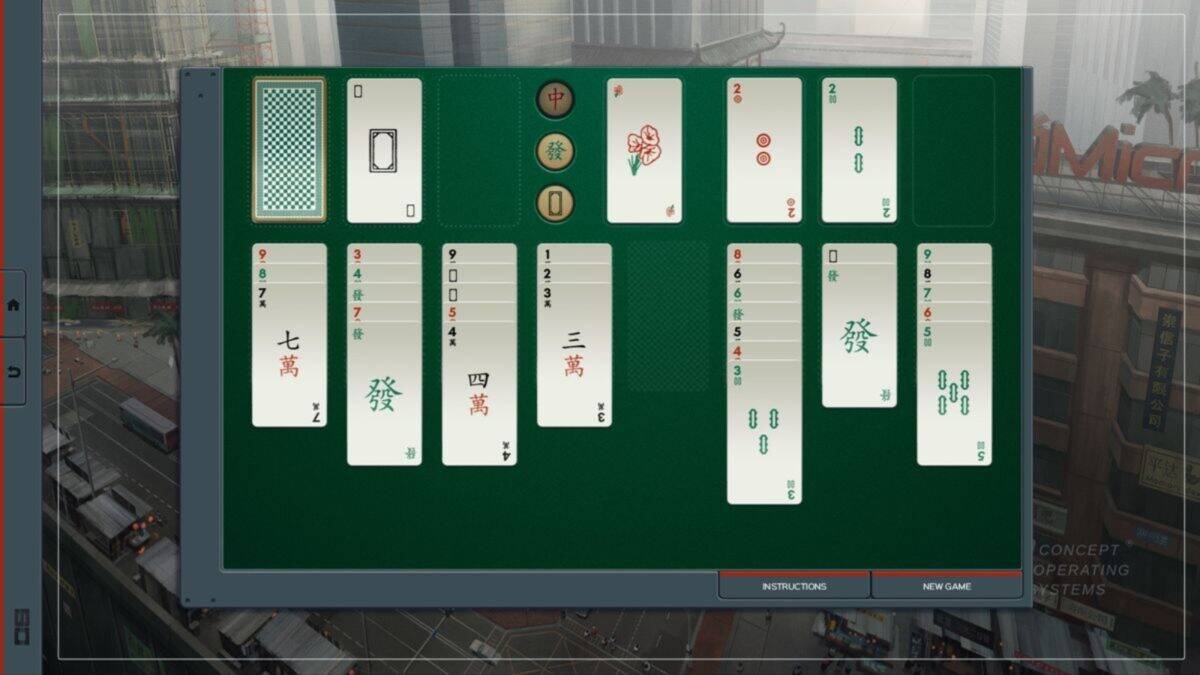 A Mahjong Solitaire game is displayed on a digital screen, with tiles arranged in columns on a green playing field and city buildings visible in the background.