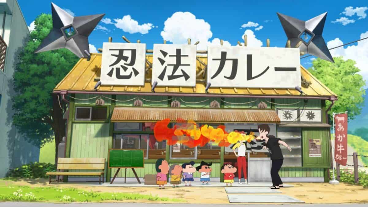 Animated scene of children watching a person breathe fire at a food stand with a sign in Japanese and two large shuriken displayed on the roof.