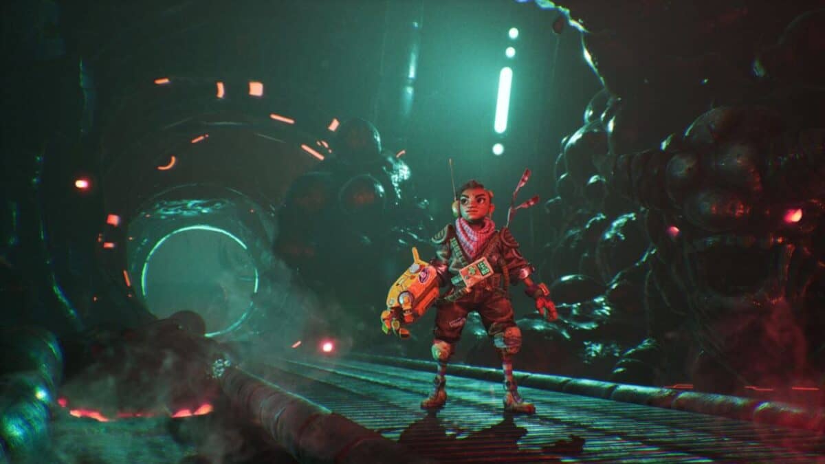 A person in a futuristic suit holds a large weapon, standing on a metal walkway inside a dimly lit, sci-fi tunnel with glowing lights and organic structures.