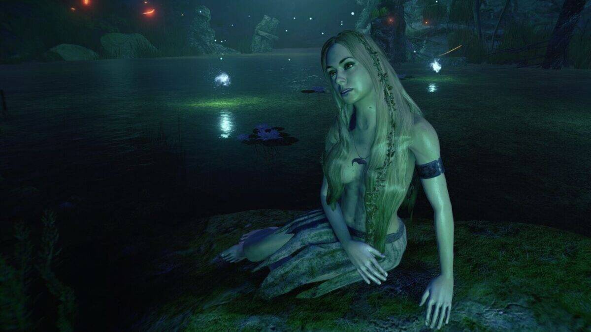 A woman with long blonde hair sits on a mossy rock near a dark, glowing lake at night, surrounded by small floating lights.