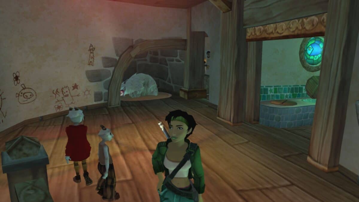 A female character stands in a wooden room with two small figures; cartoon-like drawings are on the walls and a large animal rests in an adjacent stone alcove.