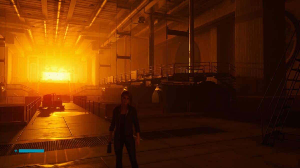 A person stands in a large industrial facility with bright orange light illuminating the background, casting deep shadows across the metallic structures.