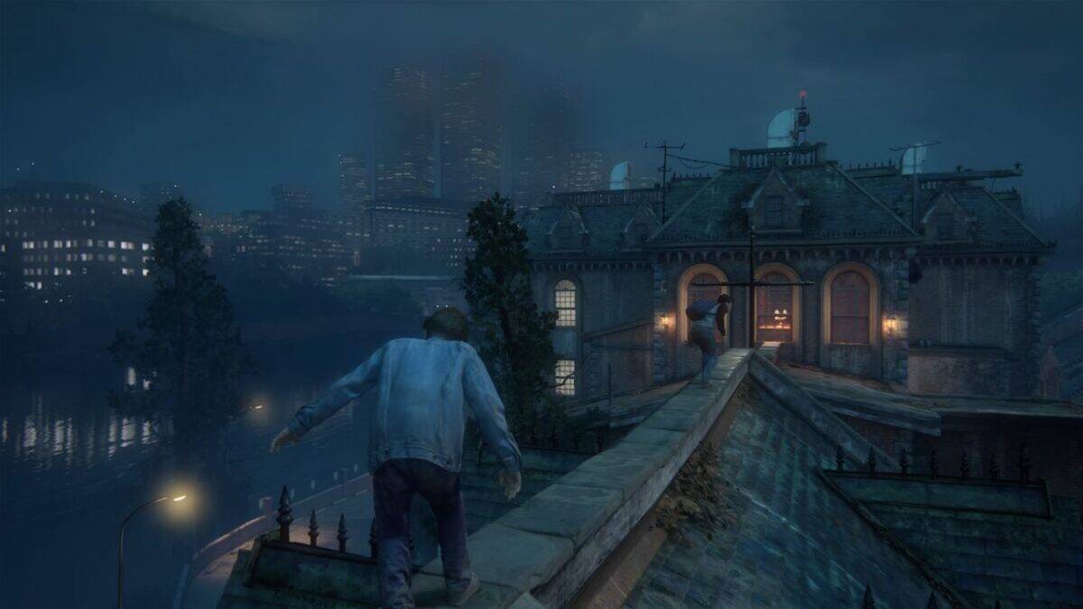 A person in a denim jacket walks along a rooftop at night toward another person near an open window, with a city skyline visible in the background.